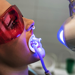 Patient receiving teeth whitening